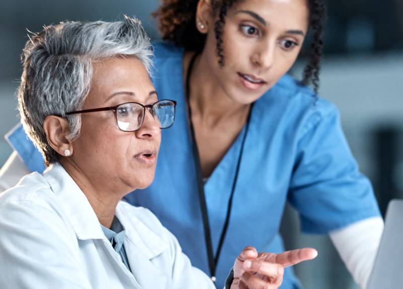 a graduate working at a new job in healthcare